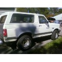 1989 Ford Bronco - This 1989 Ford Bronco is seen from the side, showing primer spots on its body.