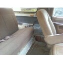 1989 Ford Bronco - Interior view showing tan seats and dashboard, possibly from a Ford Bronco.