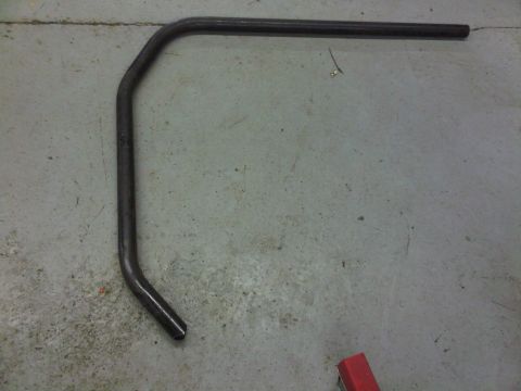 1996 Ford Bronco - A bent metal bar is shown on a concrete surface, not a 1996 Ford Bronco.