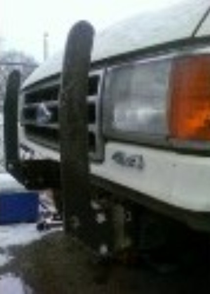 1989 Ford Bronco - The grille and headlight design suggest this is a Ford F-Series truck from the late 1980s.