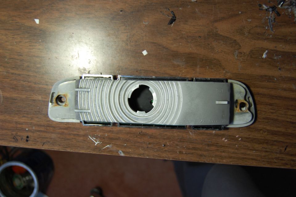 Car headlight assembly with ribbed interior and mounting holes