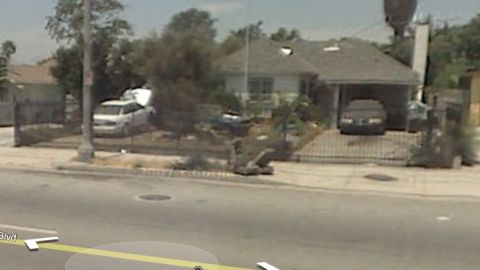1993 Ford Taurus - A residential street scene shows a house with a van and a car parked in the driveway.