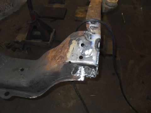 1997 Ford Ranger - Welding repairs on a vehicle frame section in a workshop setting.