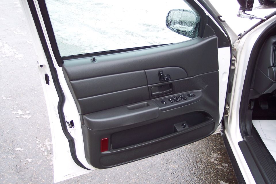 2001 Ford Crown Victoria interior door panel with window and lock controls