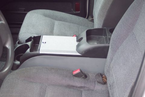 2001 Ford Crown Victoria - Close-up of the interior showing the center console and front seats with gray cloth upholstery.