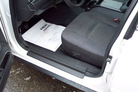 2001 Ford Crown Victoria - Interior view of a car, a driver's seat and an Exxon Superflo floor mat.