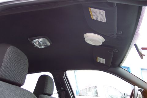 2001 Ford Crown Victoria - Interior view of a car's headliner, showing dome lights and sun visors.