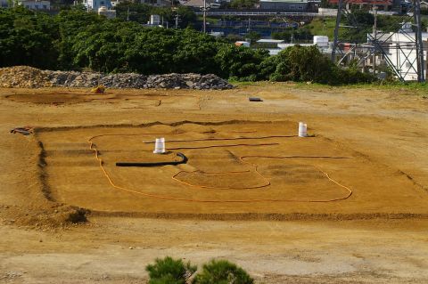 1986 Ford Bronco - A construction site is prepared with trenches and hoses, suggesting ongoing work.