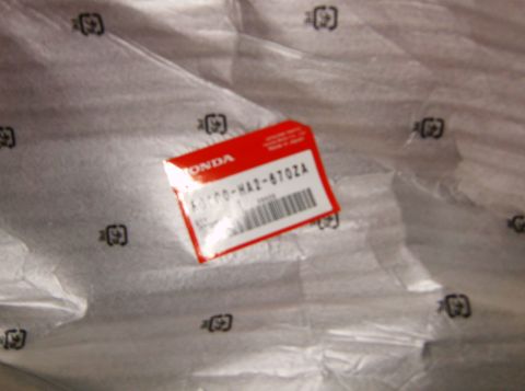 2000 Ford E350 - Honda part in packaging with part number K0100-HA2-6702A visible.