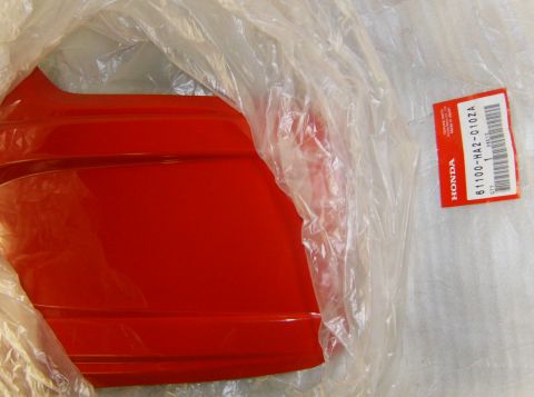 2000 Ford E350 - New red car bumper part in plastic packaging with Honda part number 61100-HA2-010ZA.