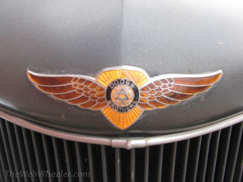 1996 Ford C-350 (Centurion Conversions) - Close-up of a vintage Dodge Brothers emblem on a vehicle's front grille.