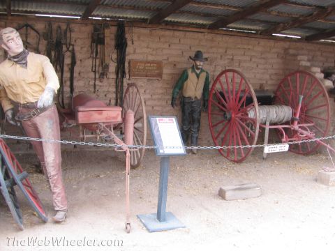 1996 Ford C-350 (Centurion Conversions) - Display of historical firefighting equipment mannequins and a hose cart.