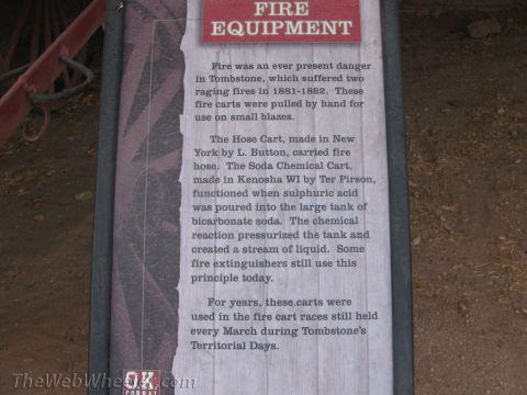 1996 Ford C-350 (Centurion Conversions) - A sign details historical fire equipment used in Tombstone, Arizona, including hose carts and soda chemical carts.