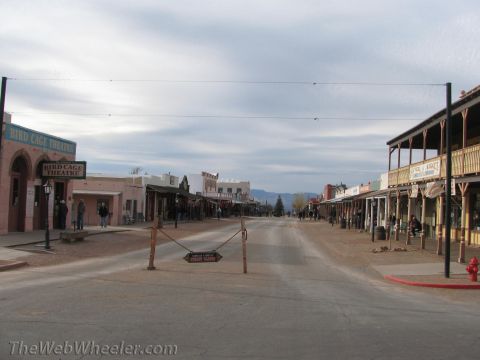 1996 Ford C-350 (Centurion Conversions) - A street scene in a Western-themed town, with buildings resembling those from the late 19th century.