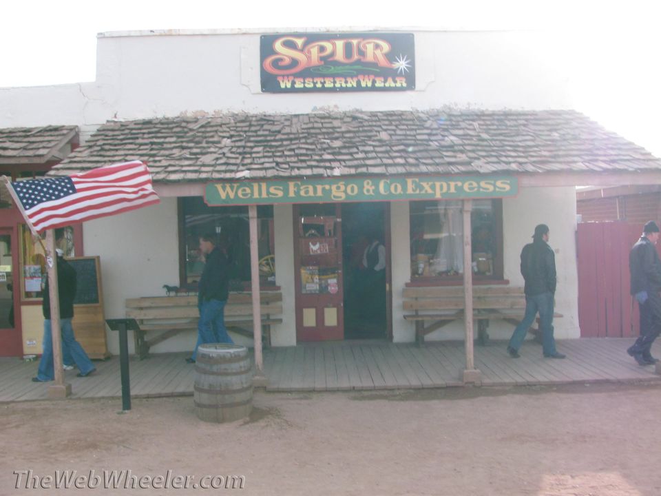 Western storefront with Spur Western Wear and Wells Fargo & Co Express signs