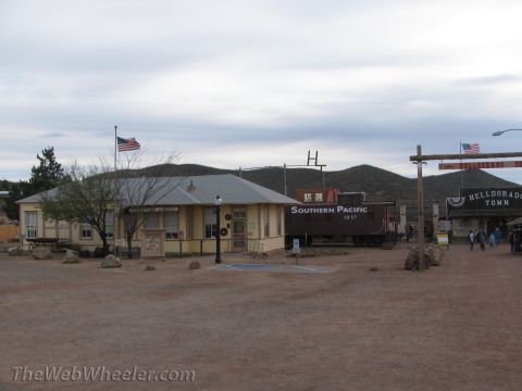 1996 Ford C-350 (Centurion Conversions) - A train car and buildings at a historical town site.