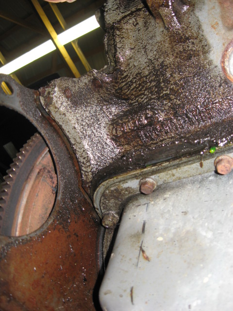 1990 Ford Bronco - Oil pan gasket behind starter motor location. Pushed all the way out. Thank you Ford Motor Company.....