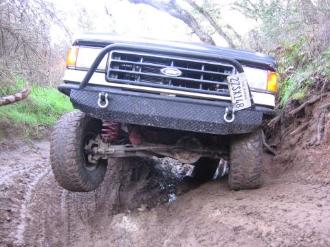 1989 Ford Bronco - This 1989 Ford Bronco navigates a challenging muddy off-road trail.