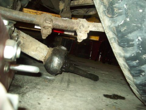 1971 Ford F-100 - Undercarriage view of a vehicle's steering components, including a tie rod end and drag link.