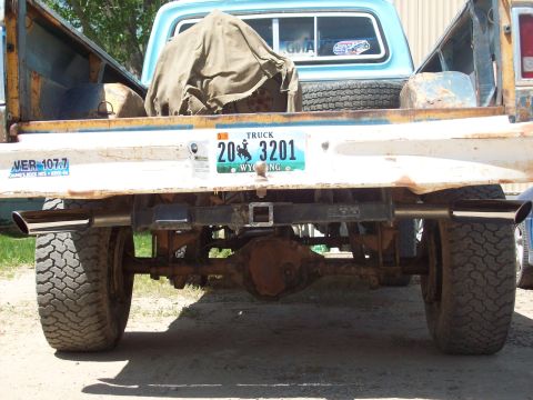 1971 Ford F-100 - Rear view of a 1971 Ford F-100 pickup truck with a Wyoming license plate and dual exhaust pipes.