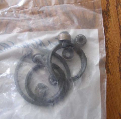 1997 Ford Taurus - A collection of rubber seals and small metal parts are visible within a plastic bag.