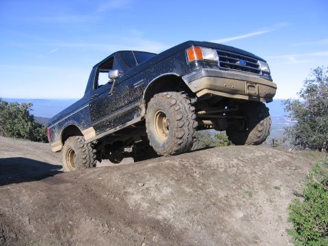 1989 Ford Bronco - This 1989 Ford Bronco is shown off-roading on a steep dirt hill.