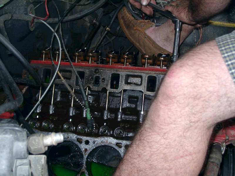Thats a shot of my dad trying to unbolt the left head. Apperently they were over-torqued?