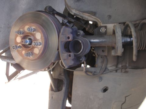 1992 Ford Taurus - Front suspension and brake assembly, likely showing a component replacement or repair.