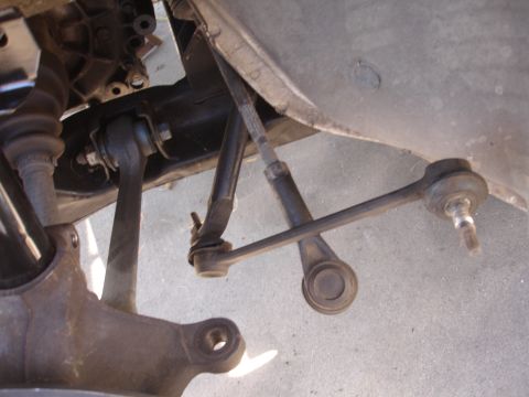 1992 Ford Taurus - Close-up view of a vehicle's front suspension system, showing various mechanical components.