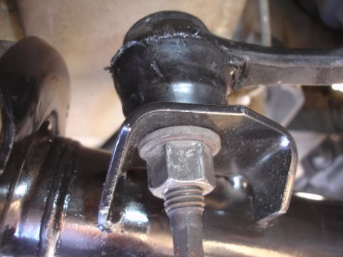 1992 Ford Taurus - A worn suspension bushing and mounting hardware are visible in this close-up view.