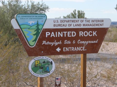 1996 Ford C-350 (Centurion Conversions) - A sign indicates the entrance to the Painted Rock Petroglyph Site & Campground, managed by the Bureau of Land Management.