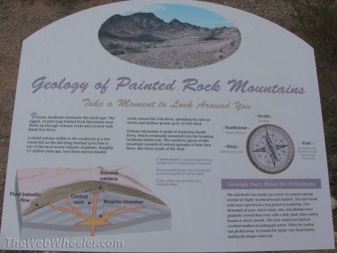 1996 Ford C-350 (Centurion Conversions) - An interpretive sign details the volcanic history and geology of the Painted Rock Mountains, including a diagram of a volcano's internal st…
