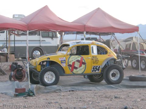1996 Ford C-350 (Centurion Conversions) - A modified Volkswagen Beetle prepared for off-road racing, parked under a canopy.