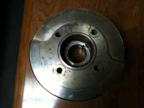 1972 Ford Ranchero - Close-up of a metal automotive part, possibly a brake rotor or hub assembly.