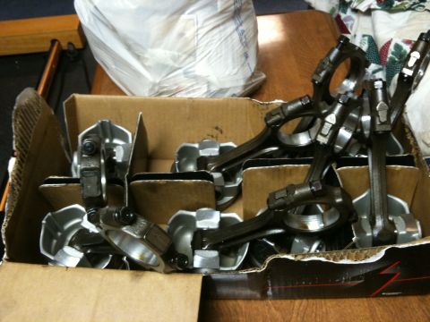 1972 Ford Ranchero - A box filled with engine connecting rods and pistons is shown, likely for a vehicle repair or project.