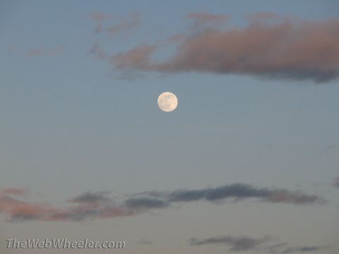 1996 Ford C-350 (Centurion Conversions) - A full moon hangs in the sky above scattered clouds.