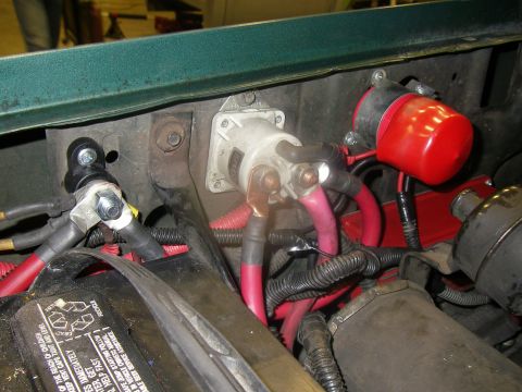 1990 Ford Bronco - Detail of vehicle electrical system components, including a relay and battery connections.