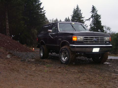 1988 Ford Bronco - This 1988 Ford Bronco is parked on a muddy, wooded hill.