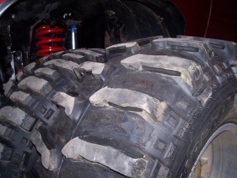 1978 Ford F-150 - Massive off-road tires dominate the frame, with suspension components peeking out from behind.