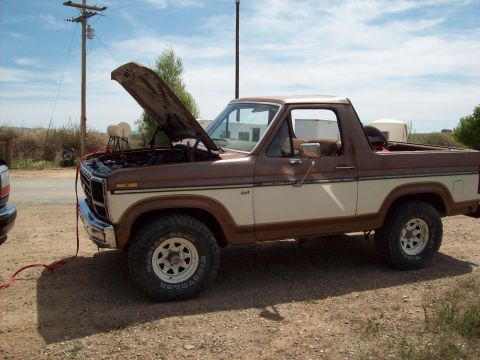 1985 Ford Bronco - This 1985 Ford Bronco is shown with its hood open, possibly undergoing maintenance or repair.
