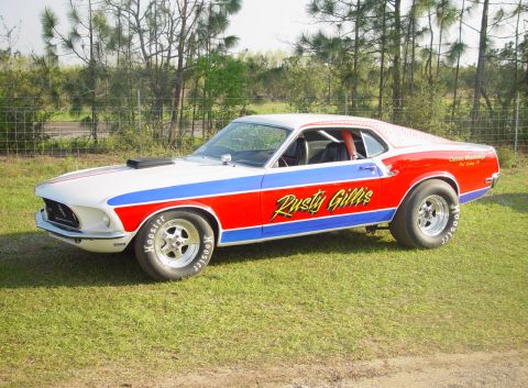 1969 Ford Fairlane - This 1969 Ford Mustang drag car features a distinctive red, white, and blue paint scheme with racing decals.