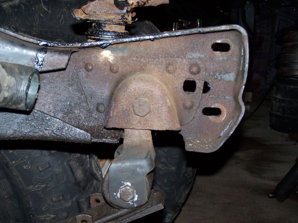 1989 Ford F-150 frame bracket with visible rust and bolts