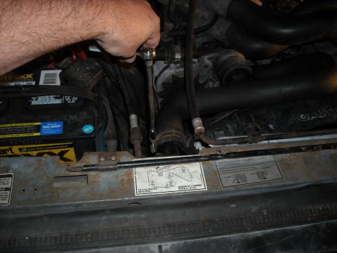 1992 Ford Bronco - I decided to remove the radiator so I would not accidentally damage it. I used an 8MM socket to take off the hose clamps