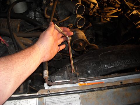 1992 Ford Bronco - A 10MM is used for the fan shroud and the radiator supports. The extension is helpful at this stage.