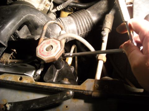1992 Ford Bronco - This small line goes to the intake. I only removed it from this side and swung it out of the way and let it lay on the pass side fender are…