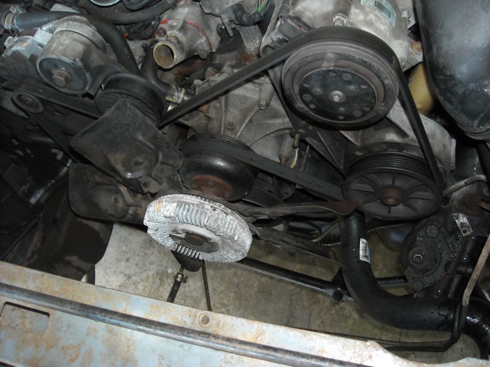 With the radiator and shroud out of the way, this is what we are looking at.
There is a LOT more room to work now.
Notice the lower is still attached to the water pump. It is a pain to take off so I left it on until the pump came out.