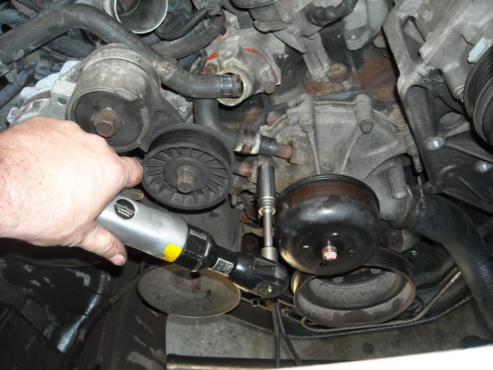 OK.. I got lazy and pulled out the air ratchet.
13MM bolts take off the rest of those holding on the water pump.
If you are on a smooth concrete garage floor, you might want to have some quik dry or kitty litter around.
Antifreeze is slick.