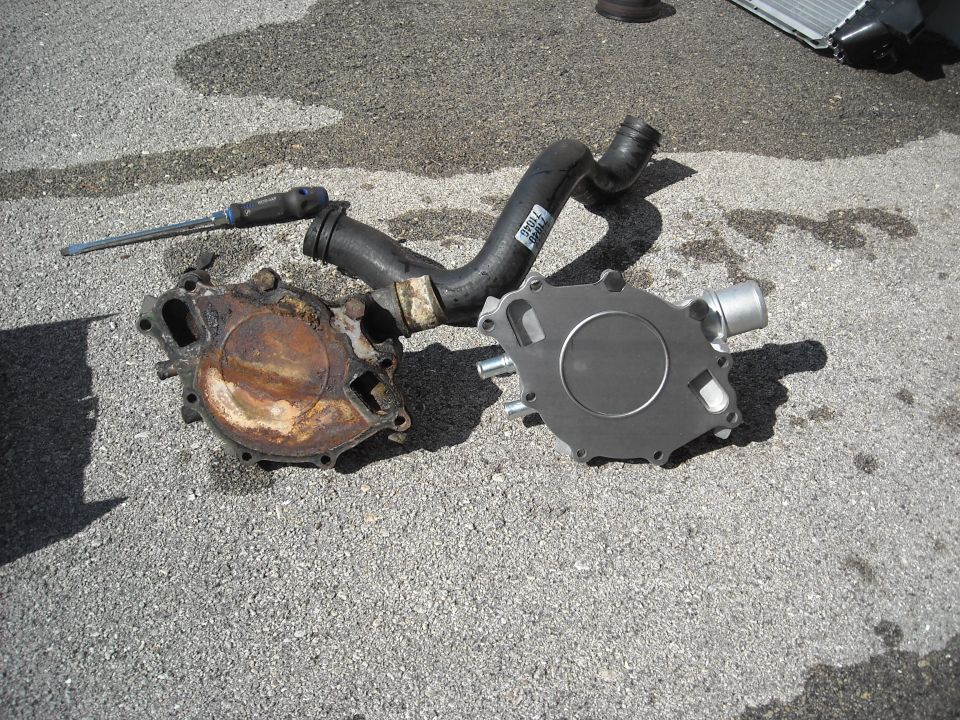 The old pump verses the new pump..
Yeah, it was time for a new one.
If you look at the old pump in about the 2:00 position, that is where it was leaking from.
