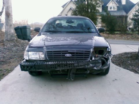 1985 Ford Crown Victoria LTD - This Ford Crown Victoria shows extensive damage to its front end, including the bumper and headlight assembly.