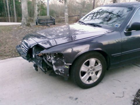 1985 Ford Crown Victoria LTD - This Ford Crown Victoria has sustained heavy front-end damage, affecting the bumper, grille, and fender.